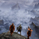 Three Elden Ring warriors stand on a cliff overlooking a foggy valley that leads to a castle.